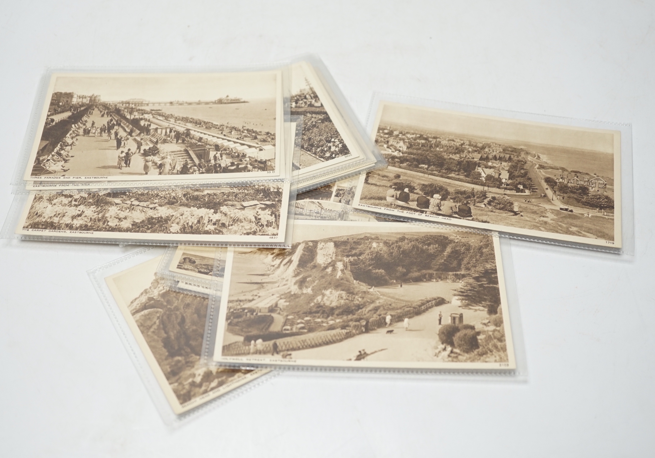 A large quantity of early to mid 20th century postcards of Eastbourne and the surrounding area, all in individual protective sleeves (in two boxes)